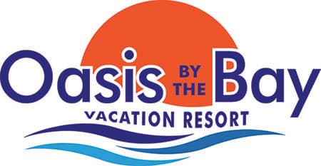 OASIS BY THE BAY VACATION SUITES logo